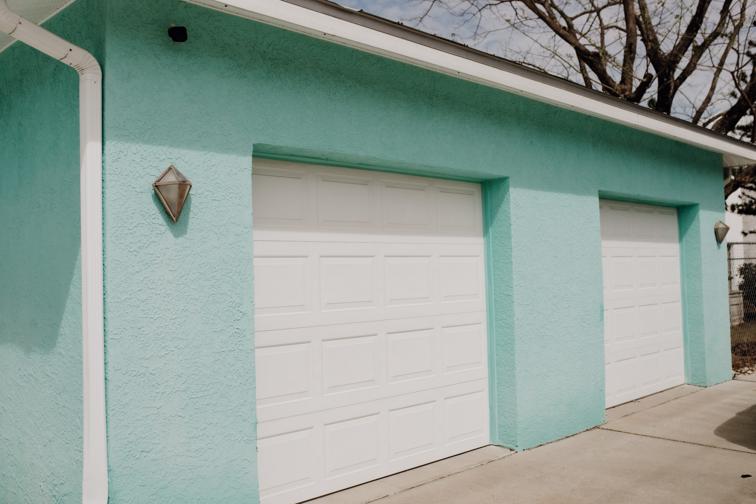 Two car garage in a Tiffany blue residence at the Fresh Life Recovery Homes located in Bradenton, FL provides sober housing for women.