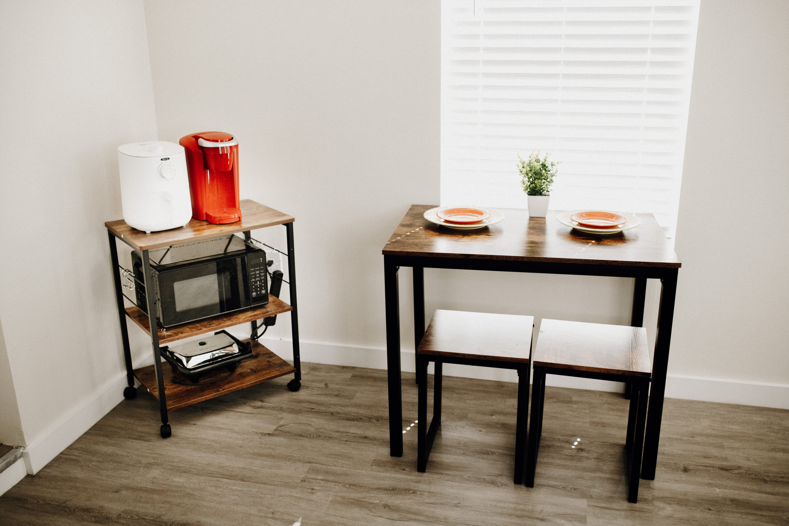 Breakfast nook with coffee maker and kettle and microwave is a lovely place to have a meal with the women of FRESH LIFE RECOVERY HOMES