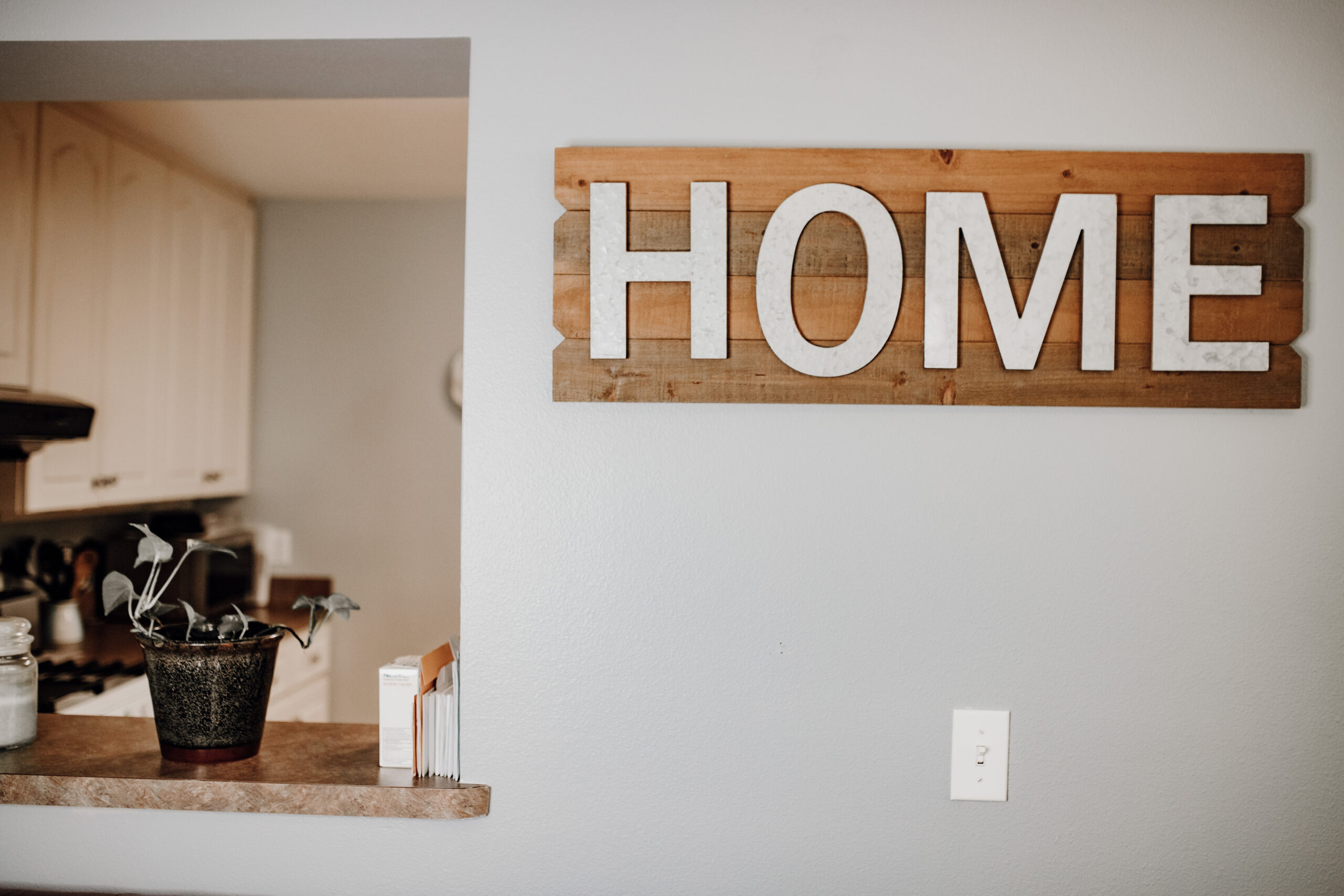 Wooden home sign in the Fresh Life Recovery Homes